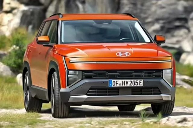 Le nouveau Hyundai Tucson gris en vue trois quarts avant dévoile son bandeau lumineux en décor urbain